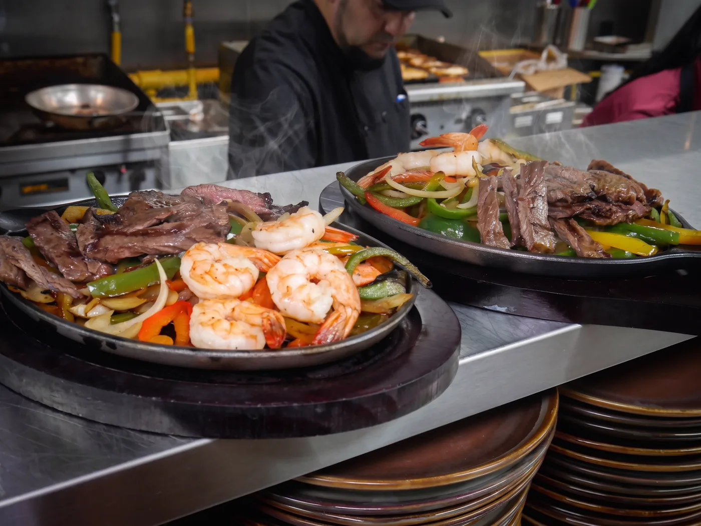 Prime Fajitas — sizzling steak and shrimp fajitas with peppers and onions