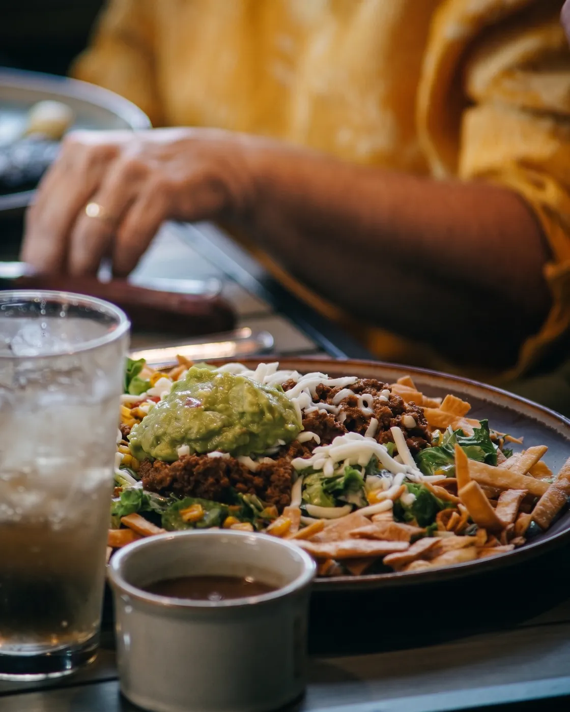 Taco salad with seasoned ground beef, guacamole, cheese, lettuce, and crispy tortilla strips — Casa Tequila Prime